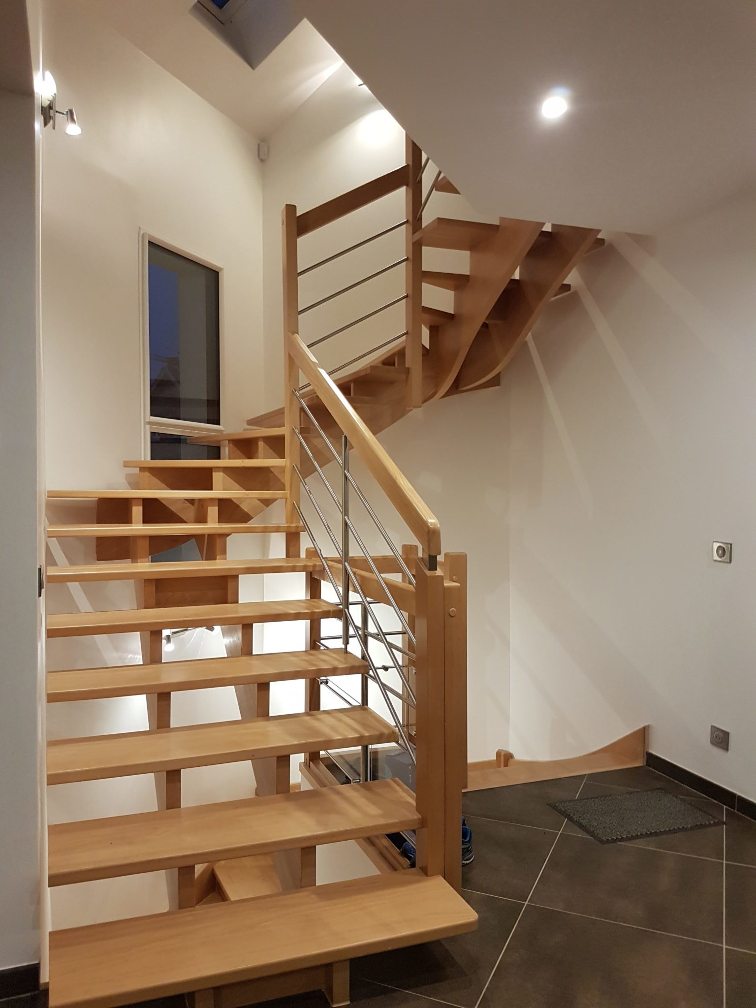 Photo of the interior wooden and steel staircase for this modern detached house